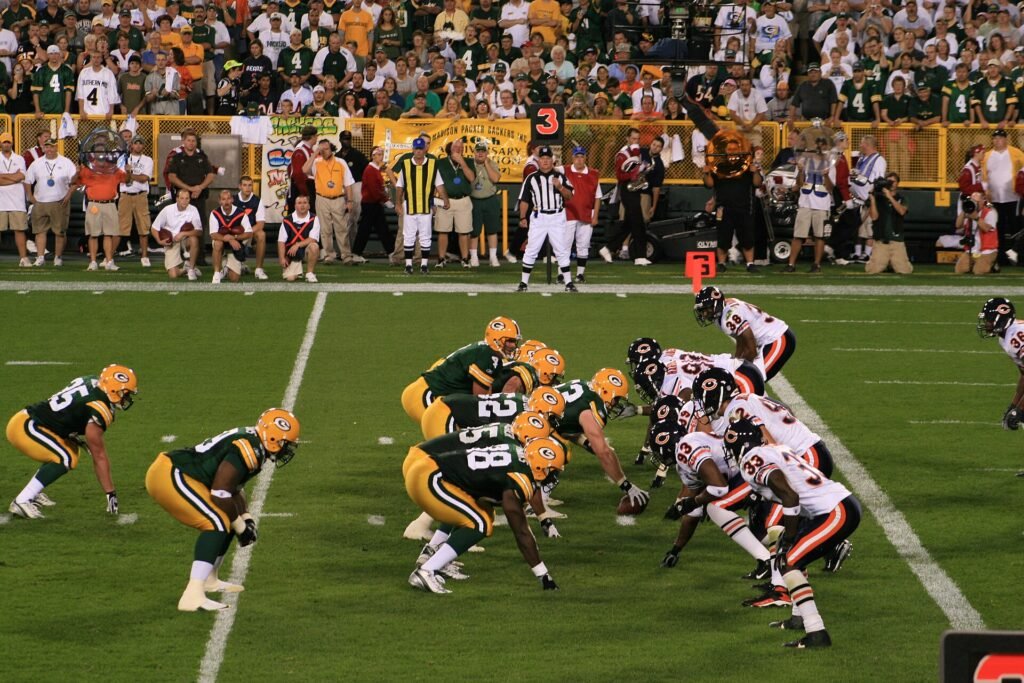 The Packers and Bears line up at the line of scrimmage at Lambeau Field.
