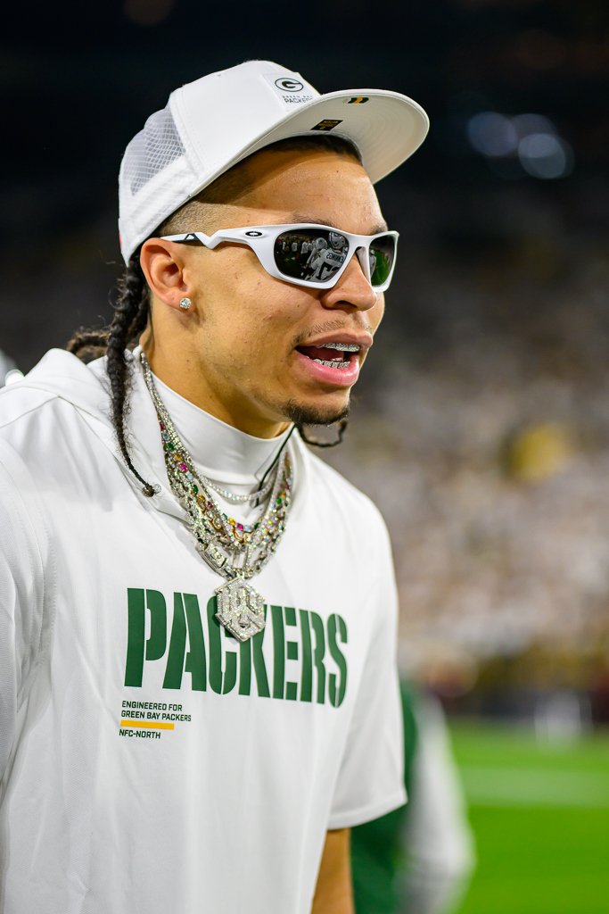 Packers receiver Christian Watson on the sideline at Lambeau Field.