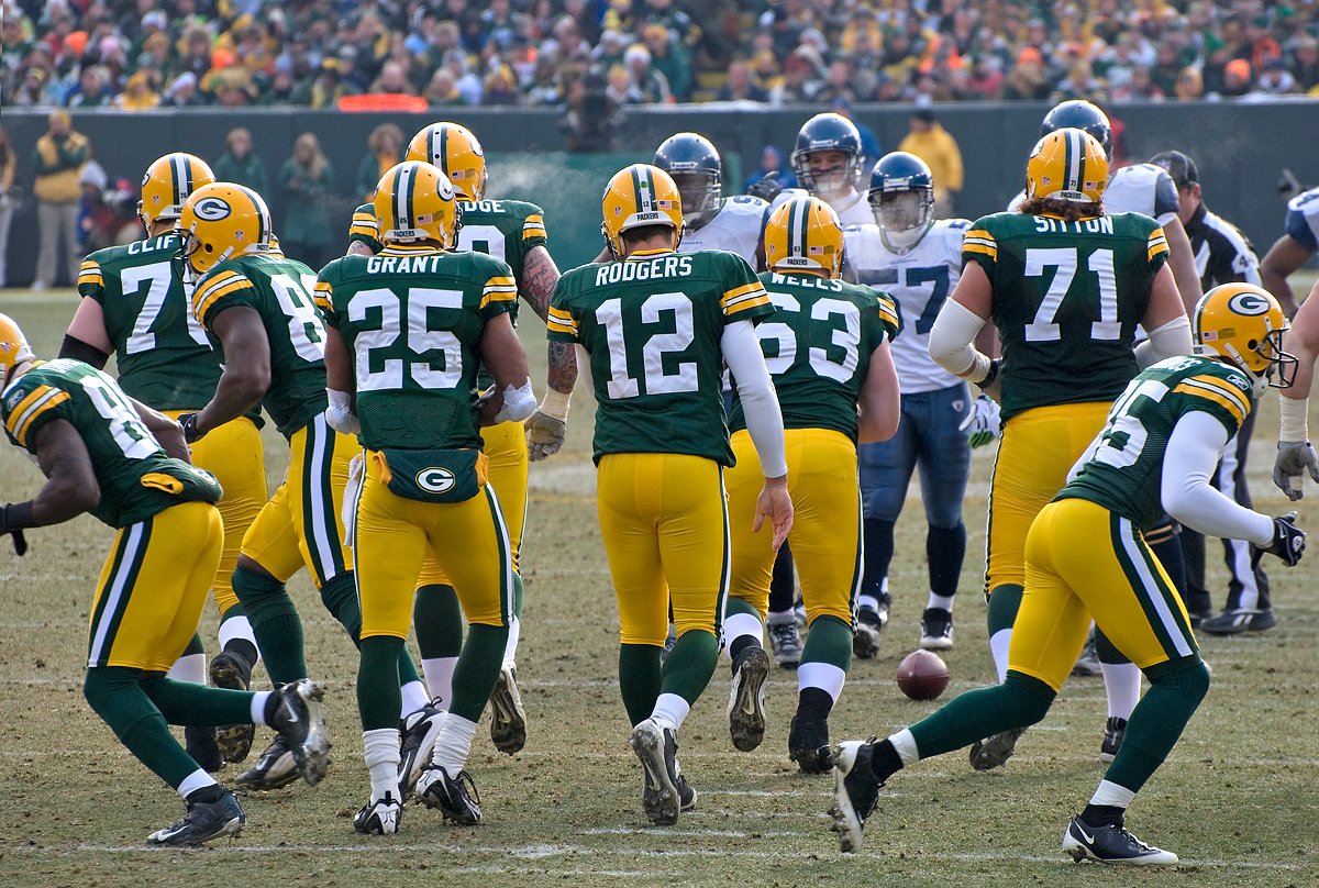 Green Bay Packers players on the field.